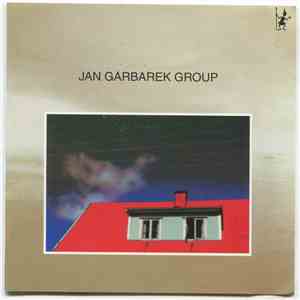 Jan Garbarek Group - Photo With Blue Sky, White Cloud, Wires, Windows And A Red Roof